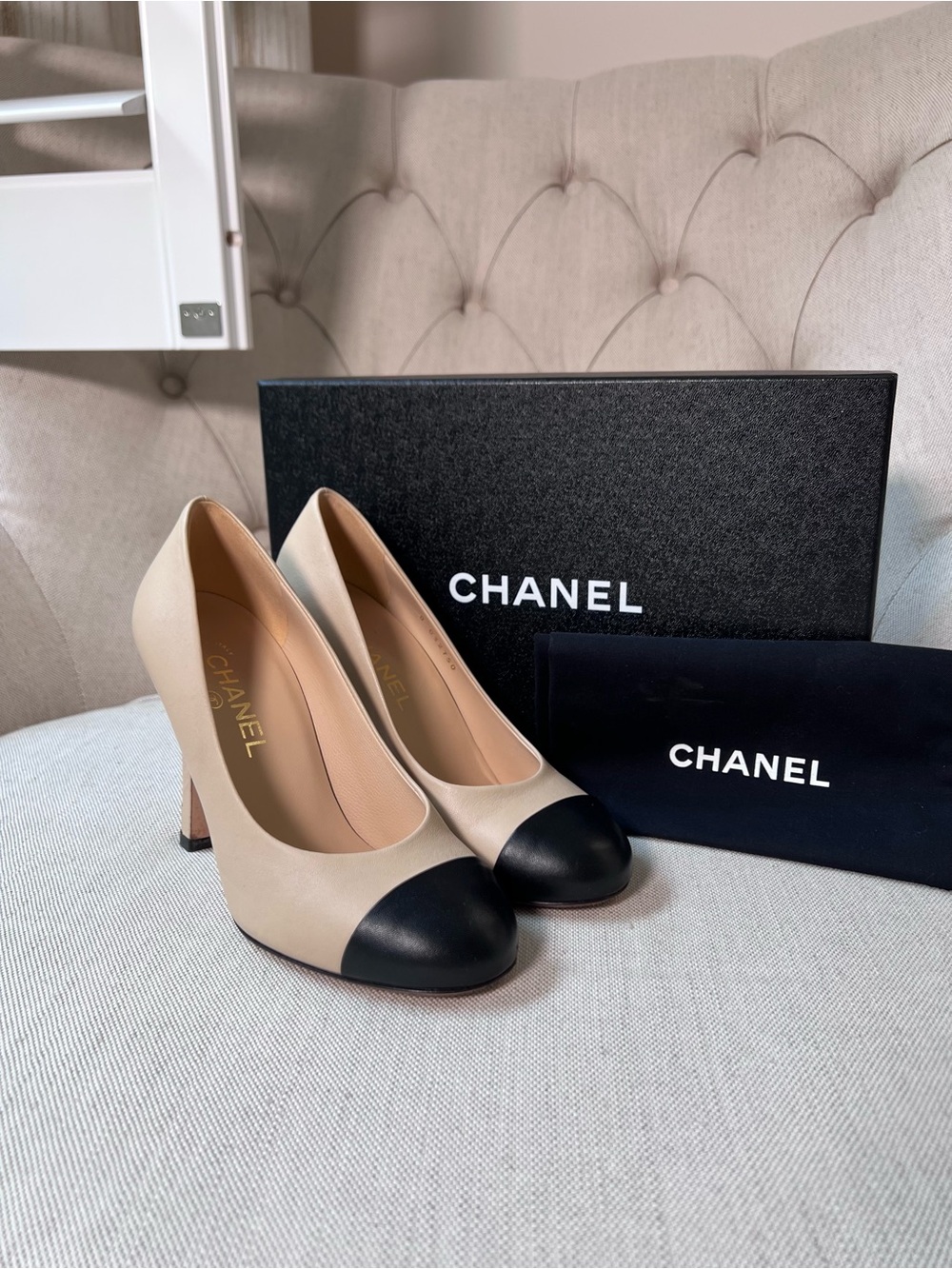 Chanel Classic Beige and Black Lambskin Pumps with Pearl Embellishment